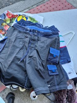 Men's size mediums, summer shorts. Hey, Tommy Higgs figure a polo by rob. Lauren and pierre c a r d I n five dollars each