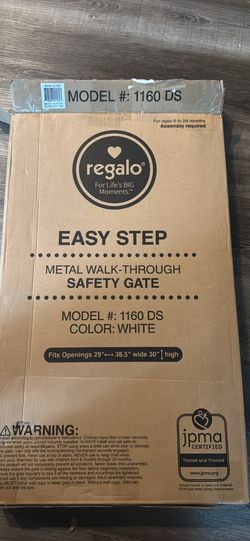 Brand new regalo white walk through baby gate 29-38.5”.  Brand new still sealed inside baby gate.   Has walk through door.  White metal.  Model 1160 D