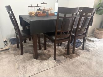 6 seating dining table wood and rug
