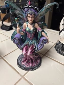 Fairy collector statue