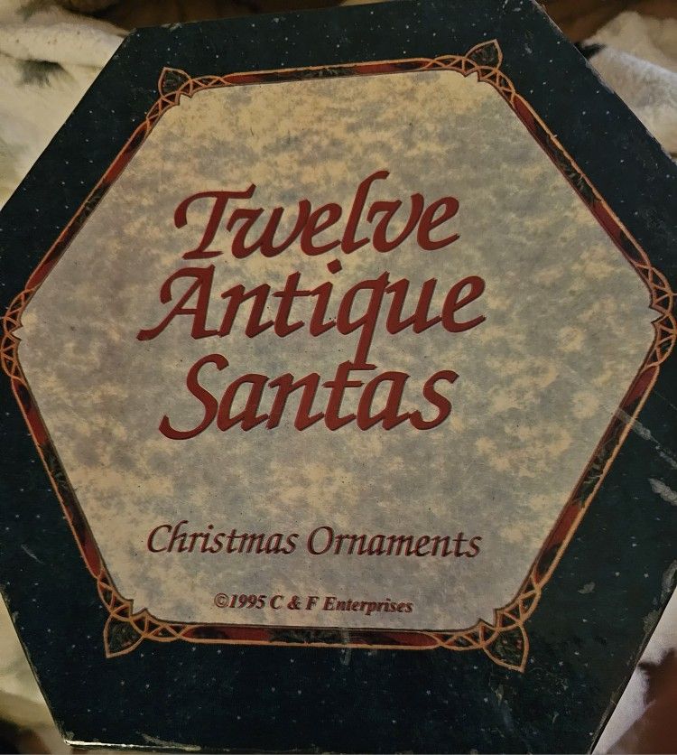 12 SANTAS ORNAMENTS.. IN ORIGINAL BOX