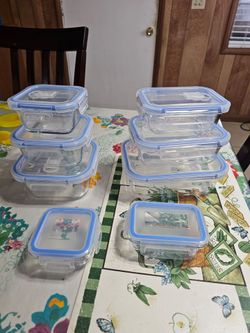 Set of 8 glass containers with lids—brand new in the box—and microwave-safe.