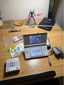 Nintendo DS Lite Bundle (Charger, flashcart + storage, extra stylus’s)