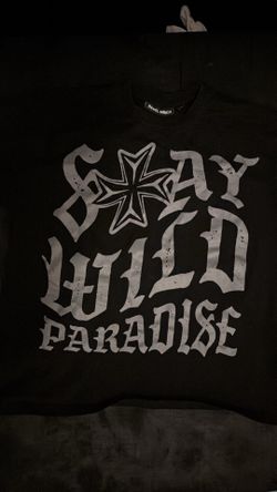 Rebel Minds Boxy Black Stay Wild Paradise t-shirt with white graphic featuring a star