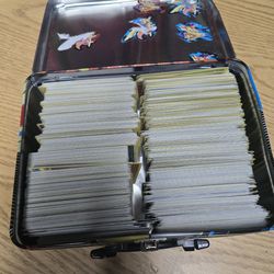 Large lot of Pokemon cards in a Pokemon lunchbox