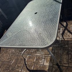 Glass And Metal Table With Six Chairs And Cushions