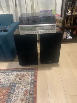Vintage Symphonic stereo radio, record player ,cassette and 8 track with Kenwood speakers ..everything works .scratch on lid cover and hole on speaker