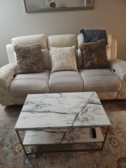Creamy recliner couch with with table