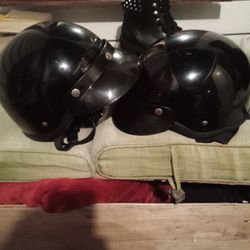 Two Black Motorcycle Helmets