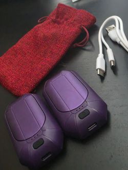 Electric hand warmers with charging cable and carrying case