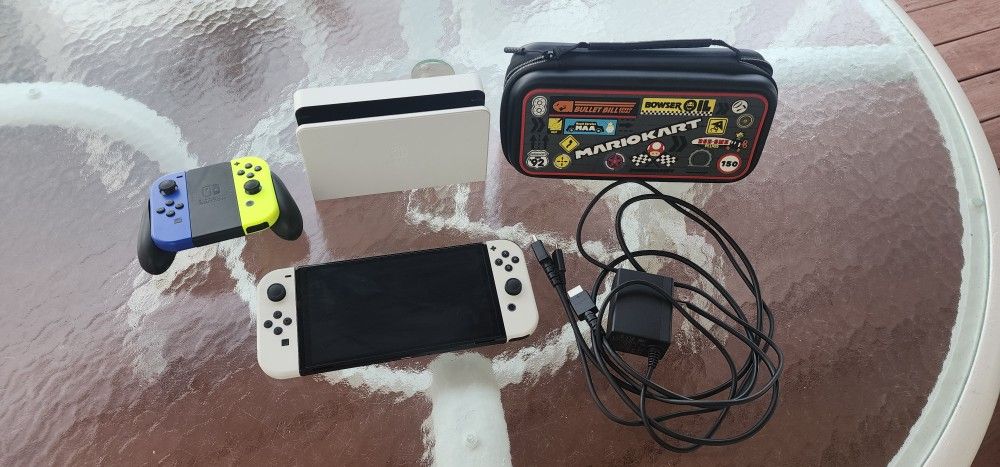 Nintendo Switch Oled With Two Joy Cons, Joy Con Grip And Mario kart Carrying Case