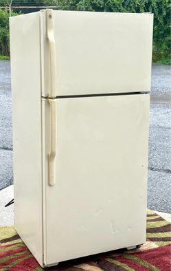 GE model 14.4 cubic foot top-mount, no-frost refrigerator. Off-White