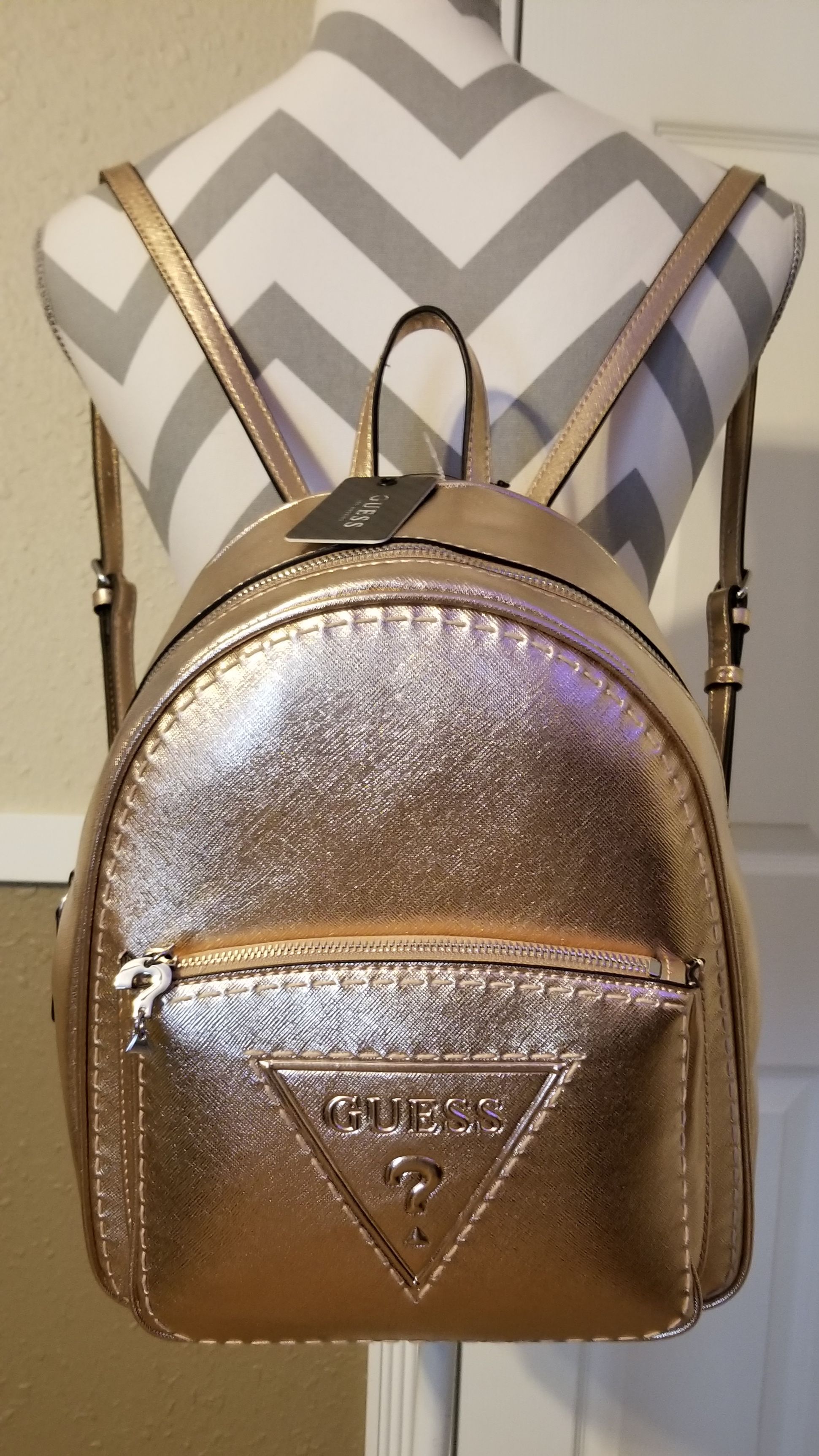GUESS backpack,adjustable straps. Large front G logo pocket, 'G' logo paper inside