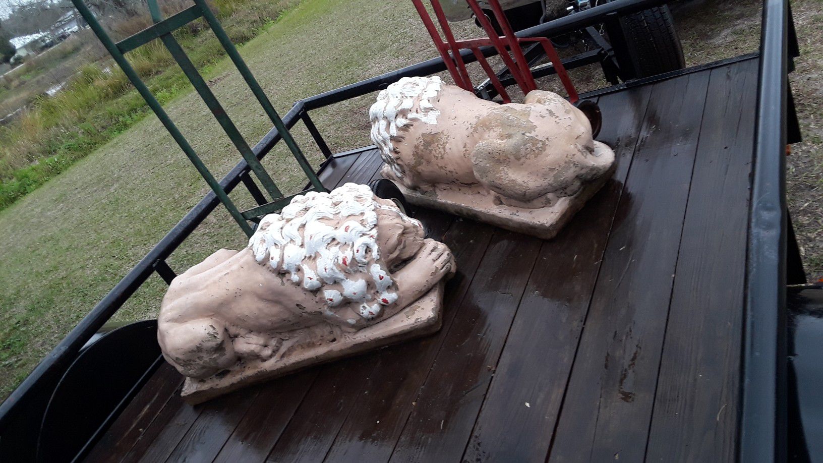 A pair of Leo lion statues very heavy