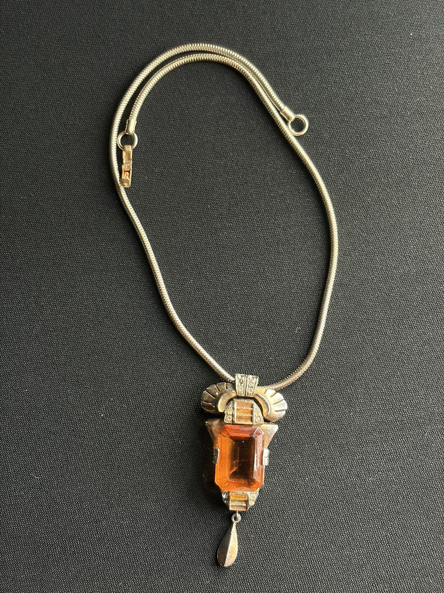 1920-30’s Art Deco-style necklace featuring a large amber-colored glass pendant 