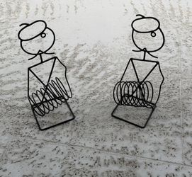 2 wrought iron wine holders.