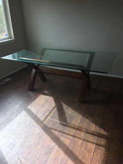 Glass table with solid wood base