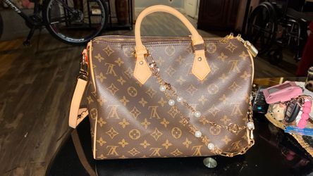 Louis Vuitton purse comes with key