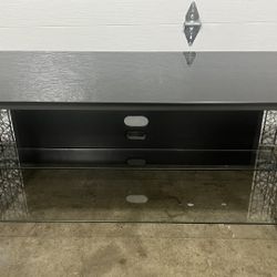 modern metal and glass TV stand or media console.