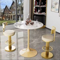 Set  of 3  40in tal bistro table 30in sintered stone bar table and two swivel high chairs. 