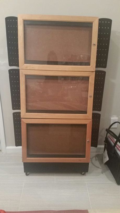 Rolling display/storage cabinet approximately 5ft. $60 *contents NOT included*