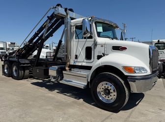 2023 Peterbilt 348 (24FT Spartan roll off)
