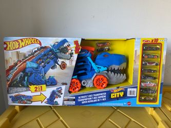 Hot Wheels Ultimate T-Rex Transporter and 10 Die-cast Cars with Lights Sounds