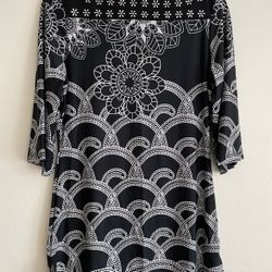 A women's mid-length top (or dress top) designed by the Lavanya brand. • Print style: It features highly recognizable black and white geometric and fl