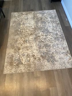 Gray and gold rug