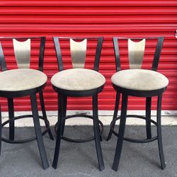 SET of 3 SWIVEL UPHOLSTERED STAINLESS STEEL BAR STOOLS (seat is 31” height) - delivery is negotiable