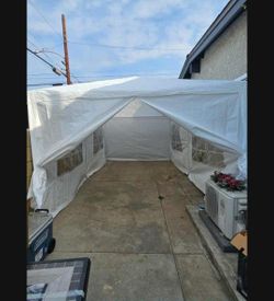 10 ft. x 20 ft. White Steel Frame Canopy Tent with Sidewalls and Stakes - Outdoor Event Shelter