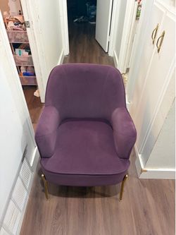 Simple plum colored chair with gold legs