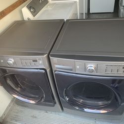 Gray Kenmore front load washer and dryer
