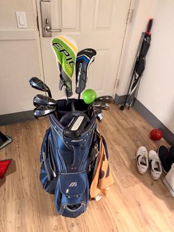 Mizzuno golf bag, Cobra T rail iron, Cleveland putter and a Cleveland Putter