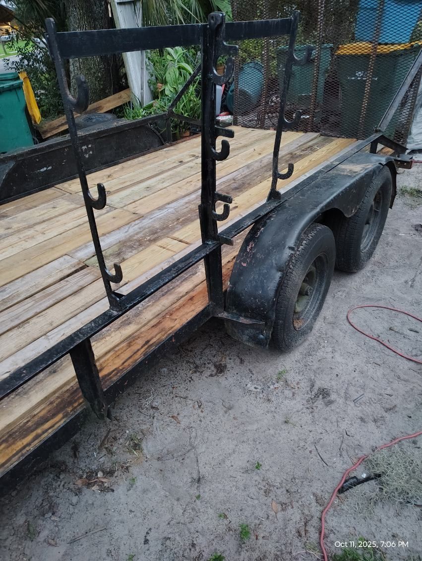 Sturdy utility trailer 16 ft long with wooden bed and metal frame. $1400 Mount Dora Fla 32757
