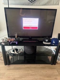 TV and black glass stand