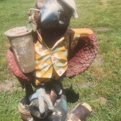 Large Parrot Drinking ..wearing Beach Clothes 