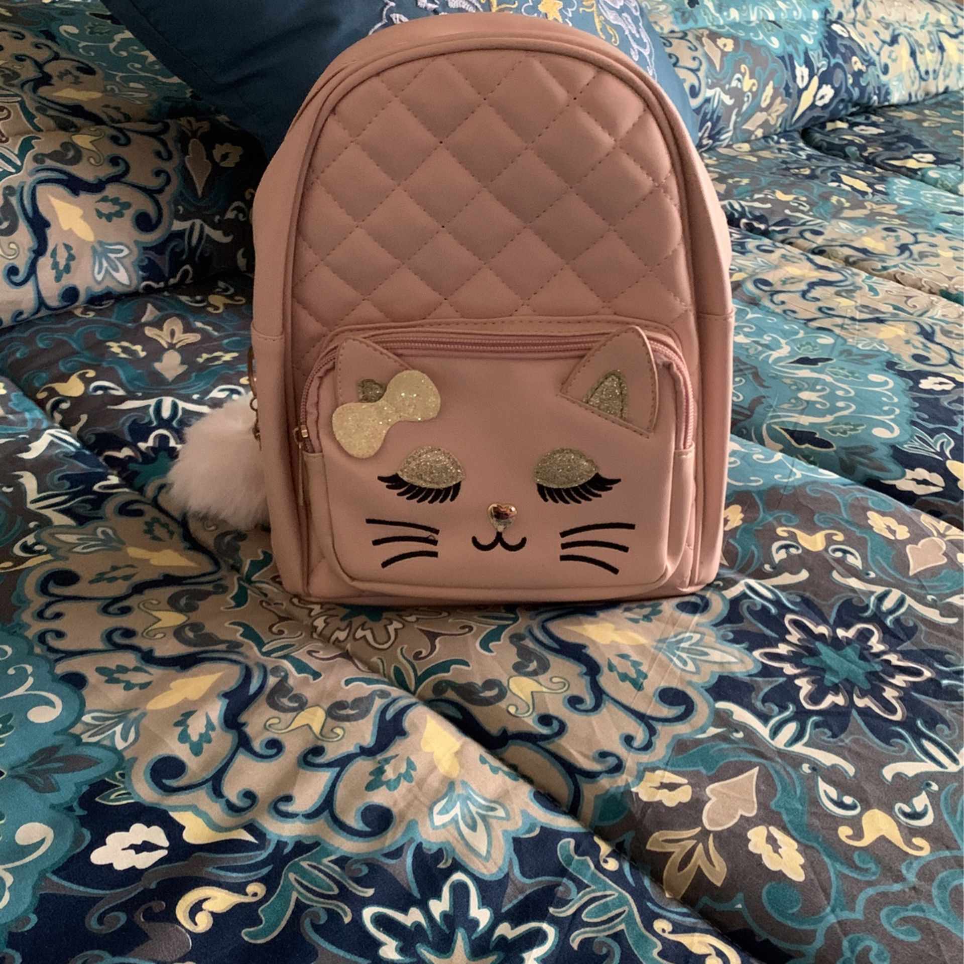 Small, Cute Backpack/hablo español