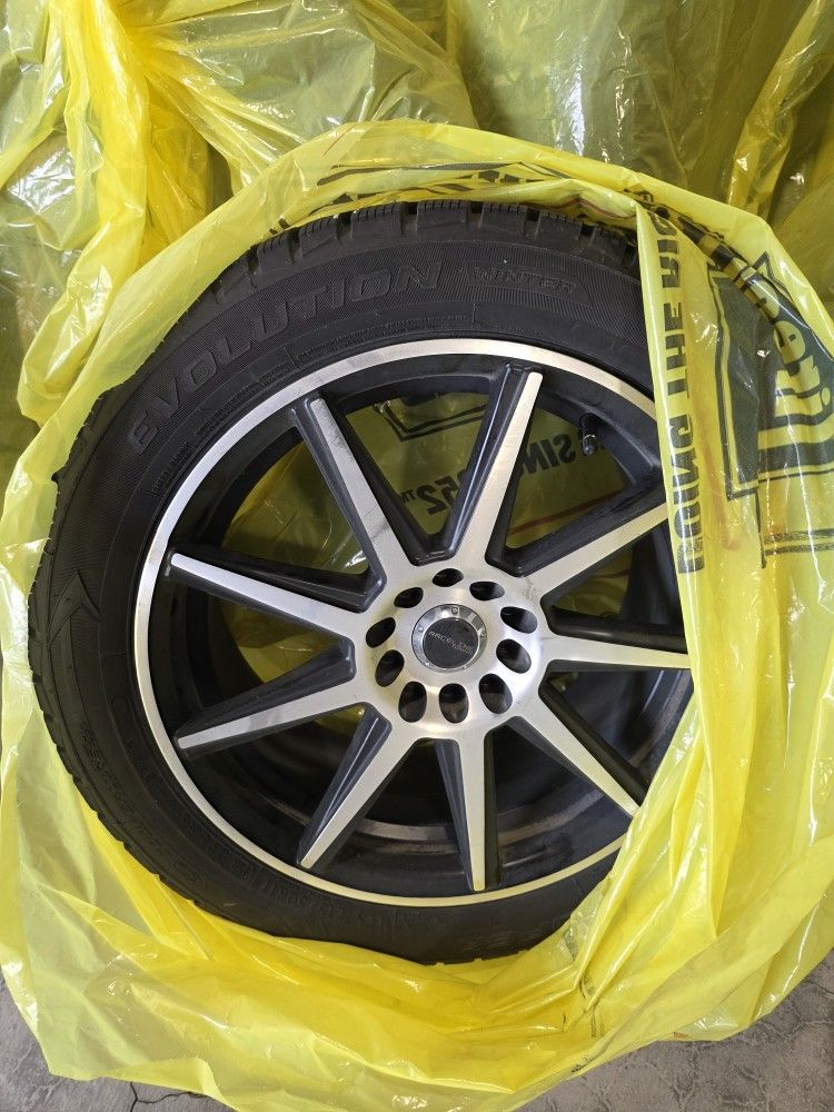 Cooper Evolution Winter Tires Studded On Wheels