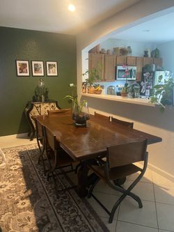 Antique solid wood table with 6  beautiful leather director chairs.