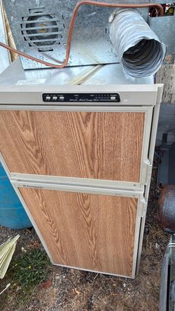Faulty electrical Dometic RV Refrigerator with Wood Panel Doors