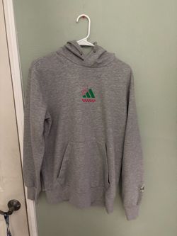 Gray Adidas hoodie with green/red logo