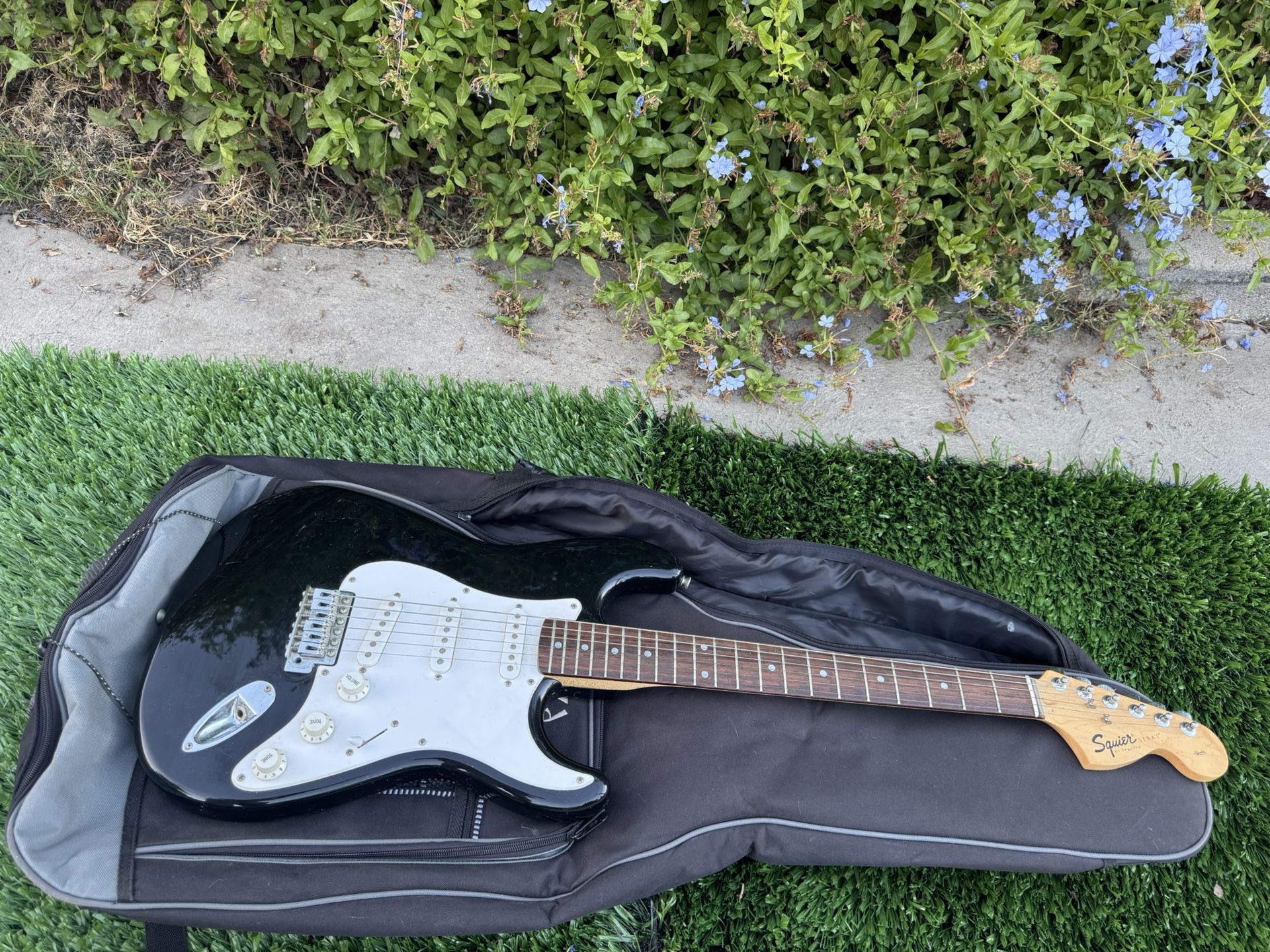 Squire Stratocaster Electric Guitar By Fender With A Carry Case