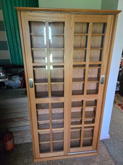 Media cabinet with sliding glass doors
