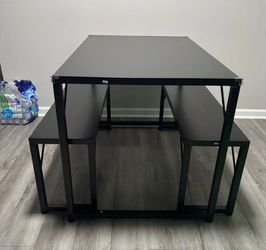 Black dining table with benches
