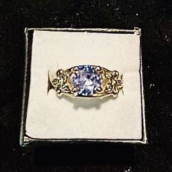 Elegant gold ring featuring a cubic zirconia.  $10