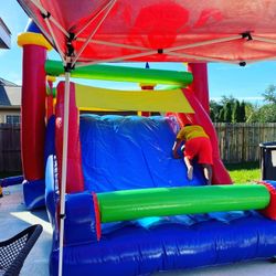 Bounce house, moonwalk waterslide.  Brincolin .