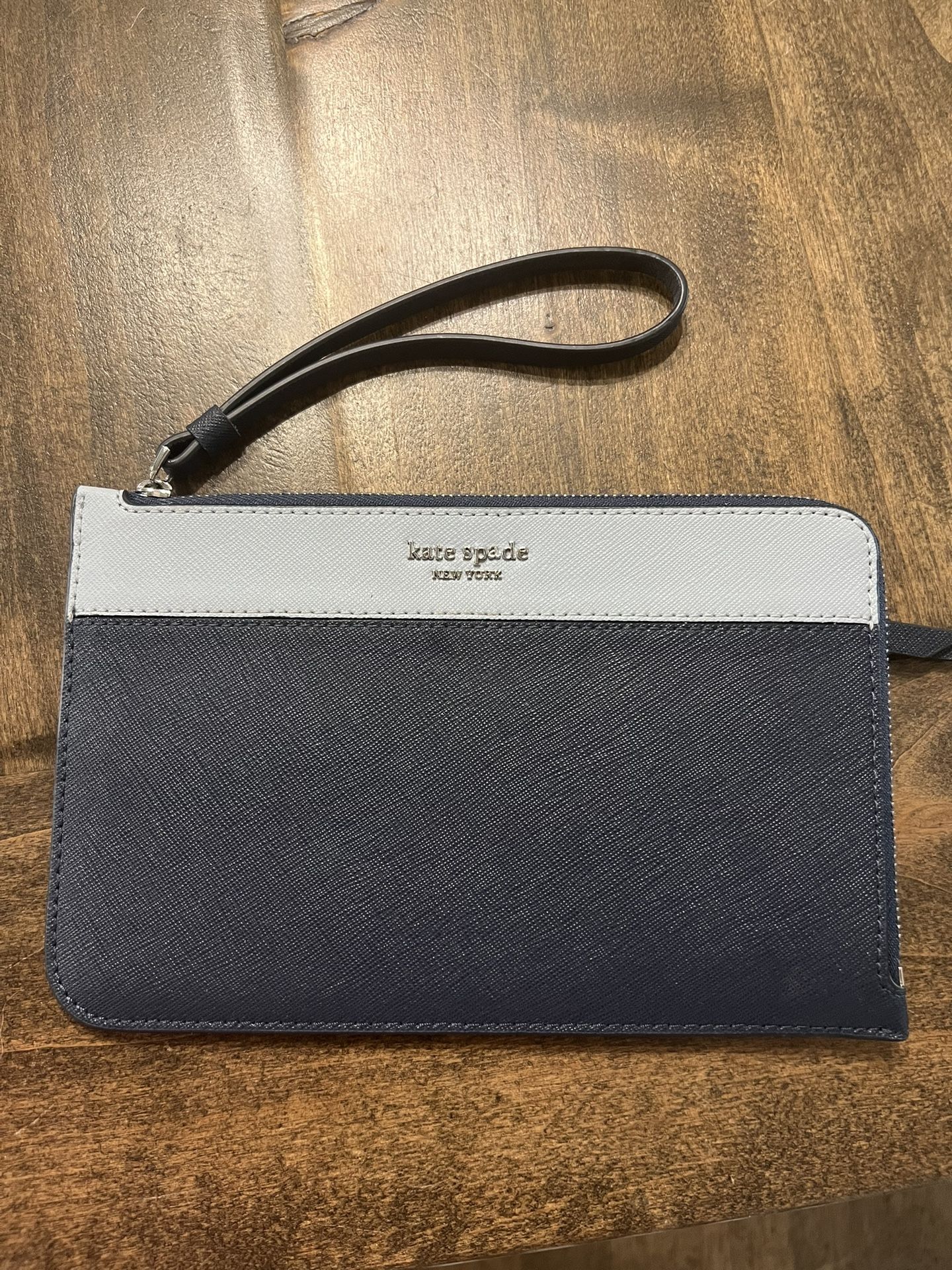 Blue kate Spade Wristlet .