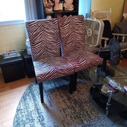 Two Brown And Cream Zebra Print Dining Chairs