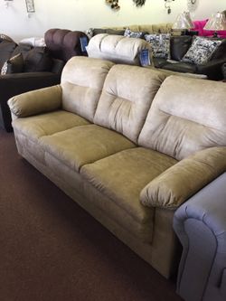 Tan microfiber sofa and loveseat